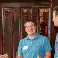 Alumni network at an event table